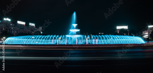 The main colorful artesian fountain in the center of Bucharest seen on a warm summer night. Bucharest, Romania