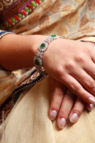 Hands of a model wearing bridal jewelry