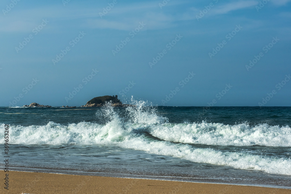 The big breaking waves during a strom at the beautiful summer sea shore background the blue sky and horizon The big breaking waves during a strom at the beautiful summer sea shore background the blue sky and horizon