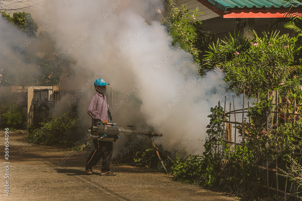 Fototapeta premium Smog officer Mosquito repellent to prevent the occurrence of dengue fever.