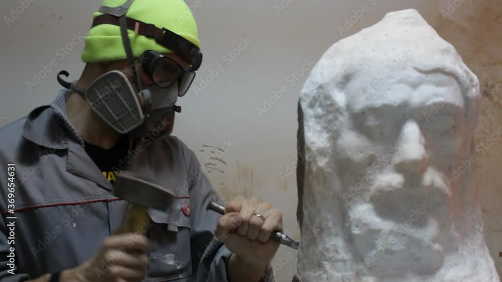 Sculptor Carving On Marble. Working with stone and sculpting statue Sculptor Carving On Marble. Working with stone and sculpting statue