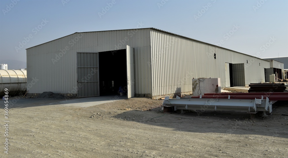 outdoor view of Industrial warehouse in the site. Industrial warehouse interior and outdoor of roof ceiling structure. outdoor view of Industrial warehouse in the site. Industrial warehouse interior and outdoor of roof ceiling structure.