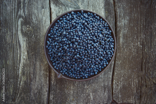 wild blueberries on rustic wooden surface