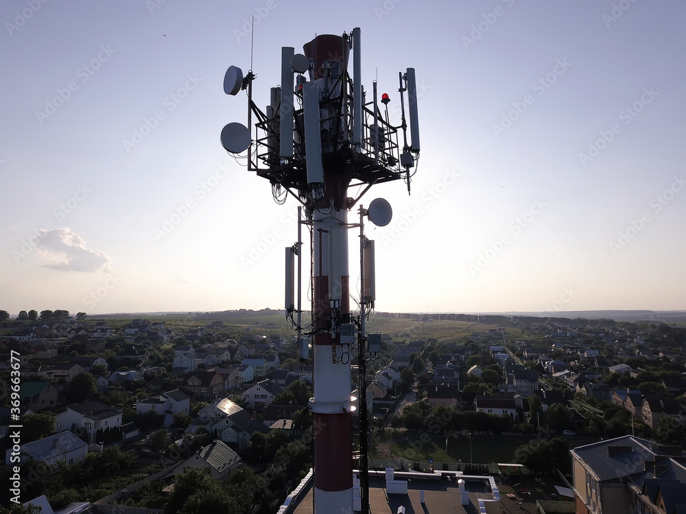 Telecommunication tower of 4G and 5G cellular. Base Station or Base Transceiver Station. Wireless Communication Antenna Transmitter. Telecommunication tower with antennas against blue sky. Telecommunication tower of 4G and 5G cellular. Base Station or Base Transceiver Station. Wireless Communication Antenna Transmitter. Telecommunication tower with antennas against blue sky.