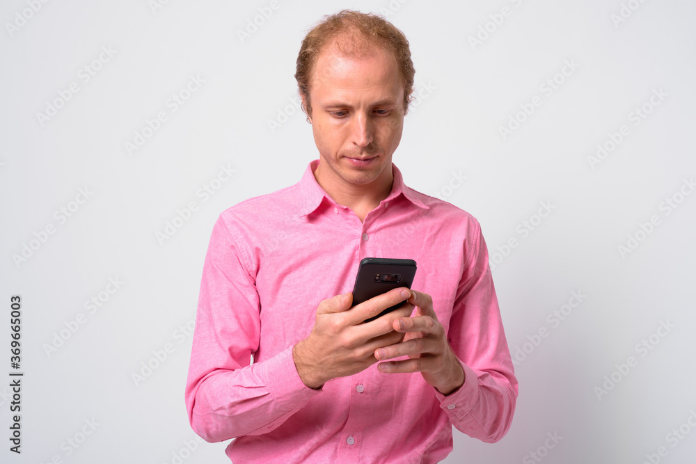 Portrait of businessman with blond hair using phone Portrait of businessman with blond hair using phone