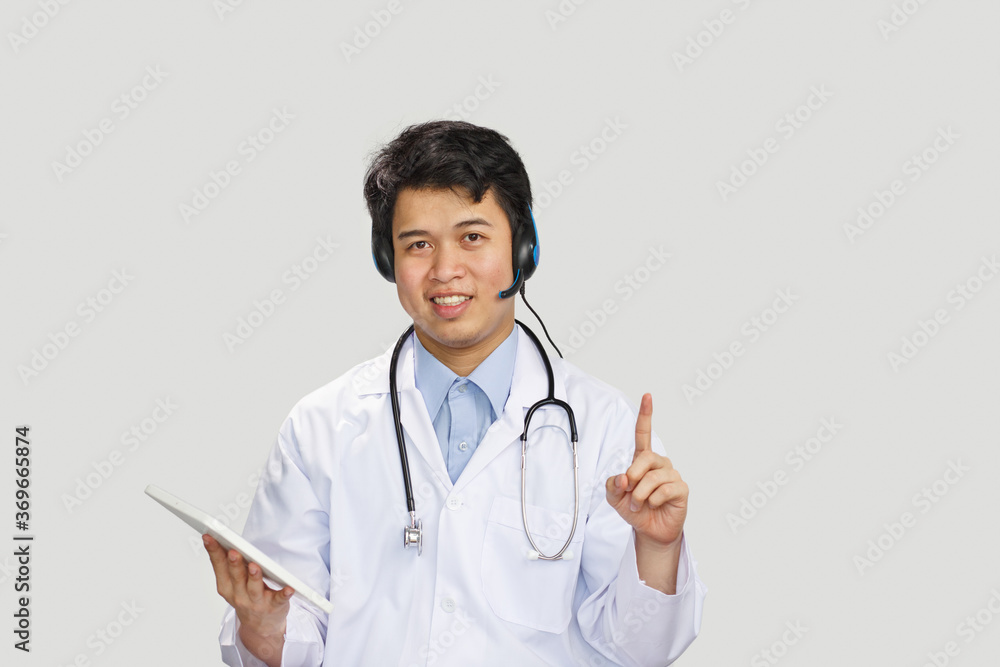 Young asian doctor with stethoscope talking with patient on white background Young asian doctor with stethoscope talking with patient on white background