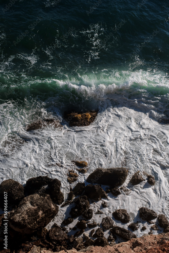Ocean wave background breaking sea water rocky shore Ocean wave background breaking sea water rocky shore