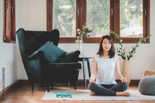 Asian woman practicing yoga meditation