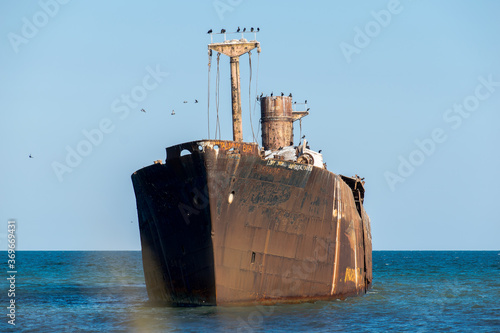 A shipwreck. An old wreck abandoned at sea. The wreck of the ship 