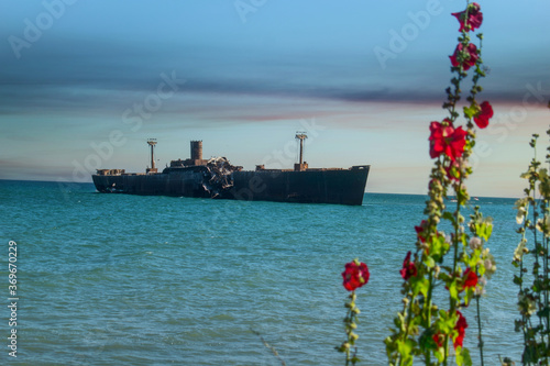 A shipwreck. An old wreck abandoned at sea. The wreck of the ship 