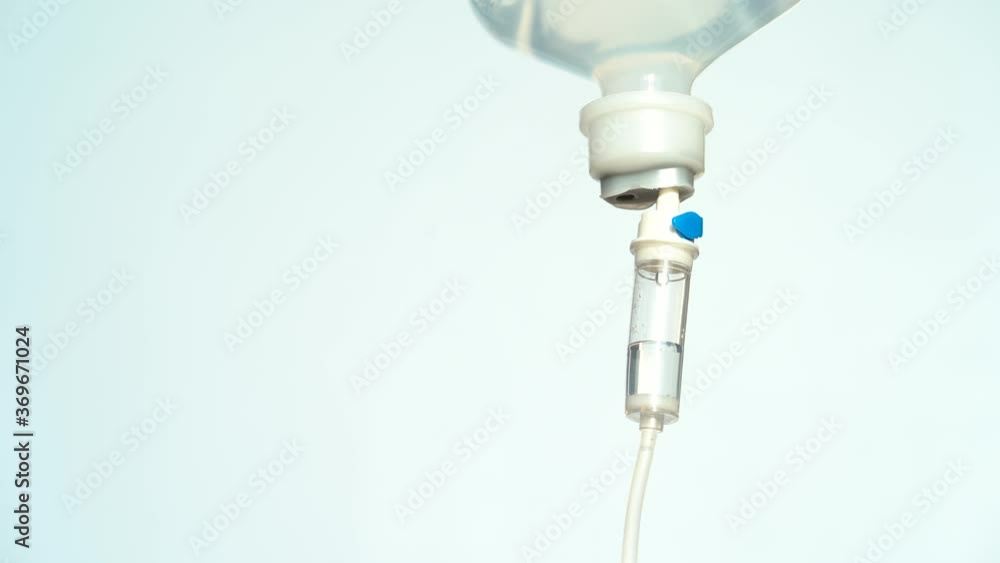 4K. Closeup of IV drip in hospital, Intravenous saline solution, IV loading dose. 4K. Closeup of IV drip in hospital, Intravenous saline solution, IV loading dose.
