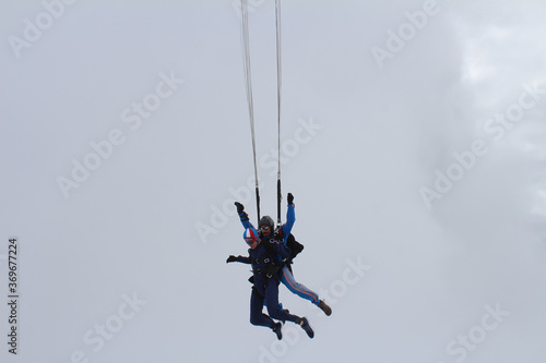 Skydiving. Two guys are flying and having fun in the sky.