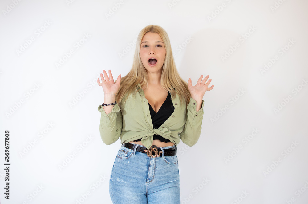 Beautiful blonde girl making the surprised gesture Beautiful blonde girl making the surprised gesture