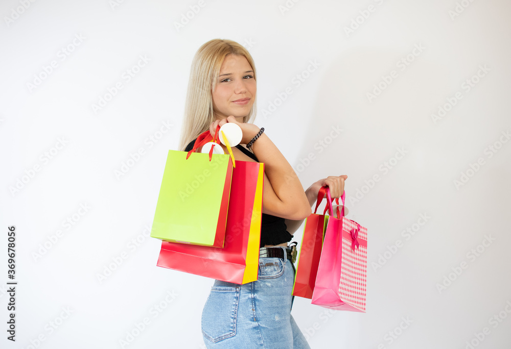 Pretty girl with shopping bags in her hands