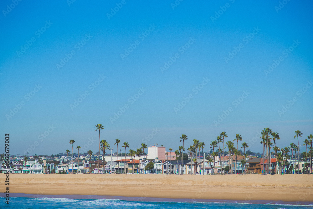 view from the Newport beach pier to the beach and houses on the island view from the Newport beach pier to the beach and houses on the island
