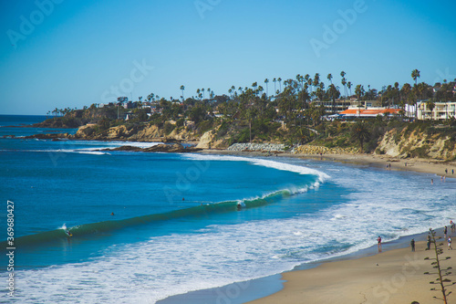 Laguna Beach is a small coastal city in Orange County, California known for it art galleries, coves and beaches. Main Beach boardwalk paths and gardens of nearby Heisler Park. stock photo 