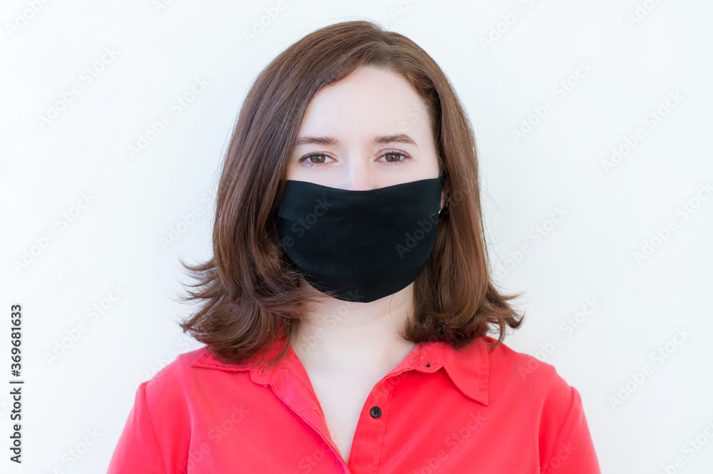 Studio portrait of girls wearing a face mask, close up, isolated on gray background. Flu epidemic, dust allergy, protection against the virus. City air pollution concept Studio portrait of girls wearing a face mask, close up, isolated on gray background. Flu epidemic, dust allergy, protection against the virus. City air pollution concept