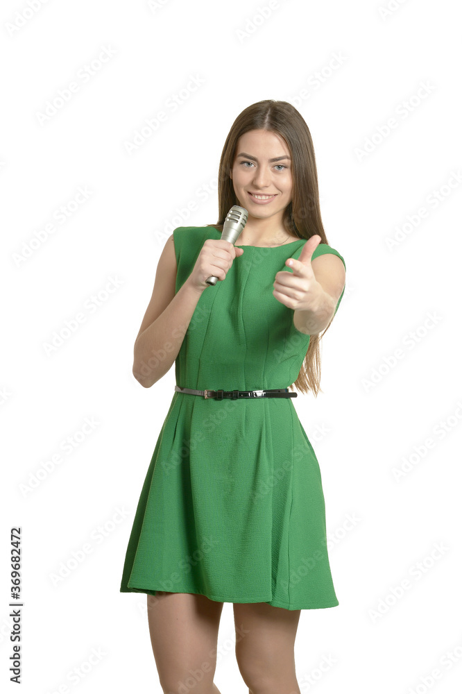 Young woman with microphone on white background
