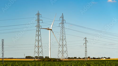 Wind turbine and high voltage power lines photo