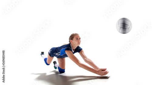Female professional volleyball players in action on white background.