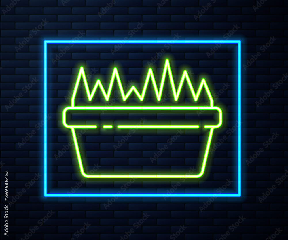 Glowing neon line Fresh grass in a rectangular icon isolated on brick wall background. Home decor. The symbol of growth and ecology. Vector Illustration.