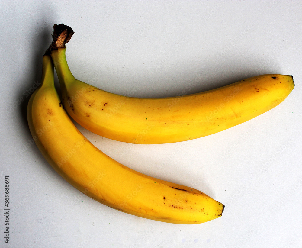 Beautiful minimalistic photo. Macro photo of a yellow banana. Beautiful summer photo. Healthy fruits Beautiful minimalistic photo. Macro photo of a yellow banana. Beautiful summer photo. Healthy fruits