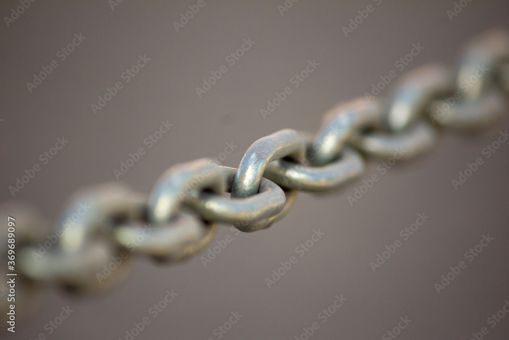 steel chrome chain on gray background steel chrome chain on gray background