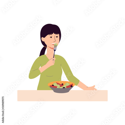 Young woman eating salad with fork isolated on white background