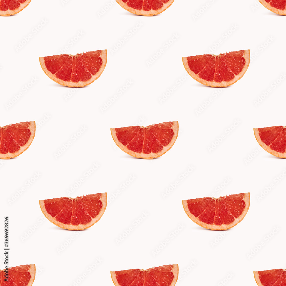 Geometric seamless pattern, grapefruit slices on a light background Geometric seamless pattern, grapefruit slices on a light background