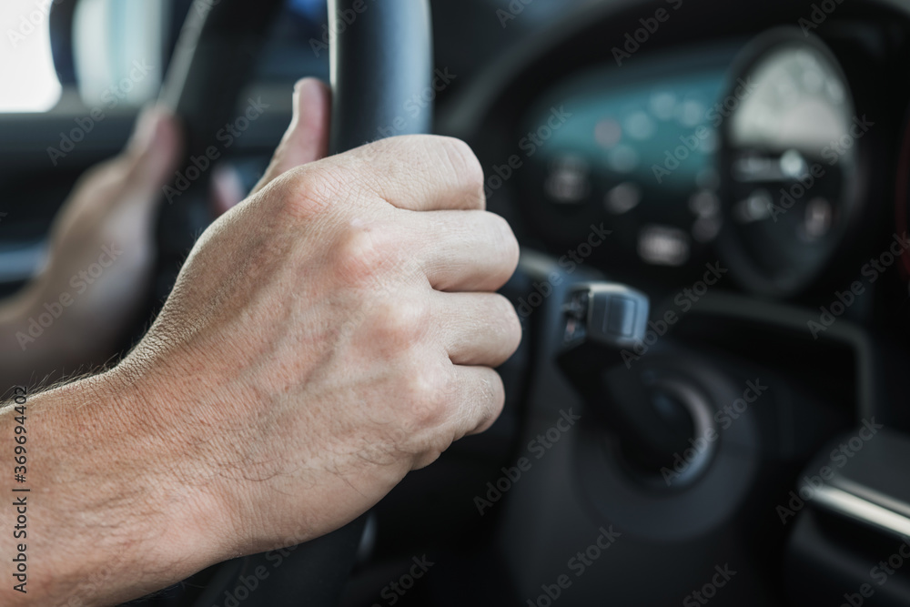 Hands On Steering Wheel Of Car.