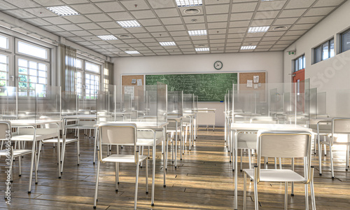 Foto interior of a school with desks equipped with protective plexiglass screens