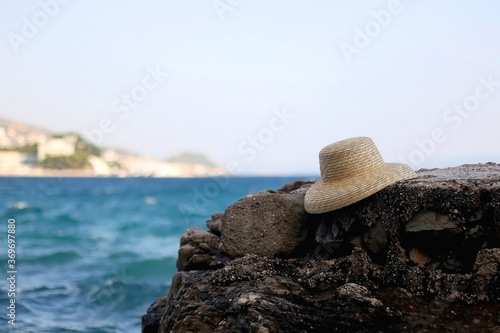Straw hat on a beach. Selective focus.