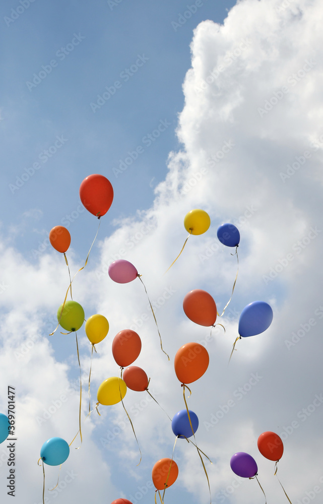 colorful balloons flying in the blue sky colorful balloons flying in the blue sky