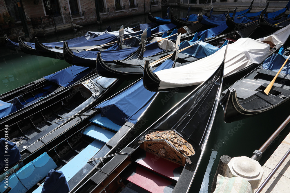 many moored gondolas without tourists and because of the coronav
