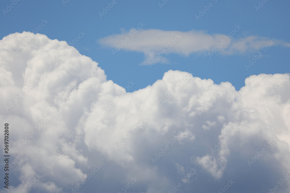 fluffy white cumulonimbus clouds and the blue sky in summer idea fluffy white cumulonimbus clouds and the blue sky in summer idea