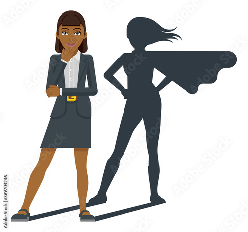 A young Asian business woman revealed as super hero by his superhero silhouette shadow