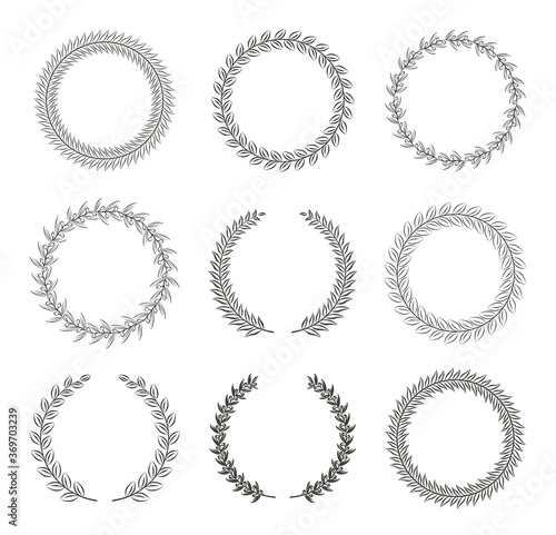 Set of black and white silhouette circular laurel foliate and olive wreaths depicting an award, achievement, heraldry, nobility. Vector illustration.