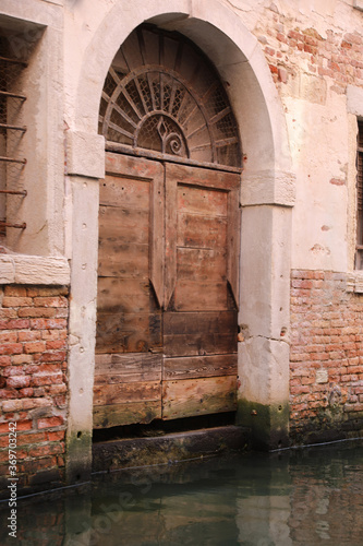 gate ruined by the erosion of the water during high tide in Veni