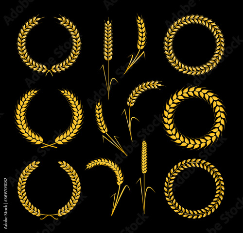 Golden wreaths and ears wheat. Design element for decoration of  award, medal, coat of arms or anniversary logo.  Golden silhouette on black background. Vector illustration