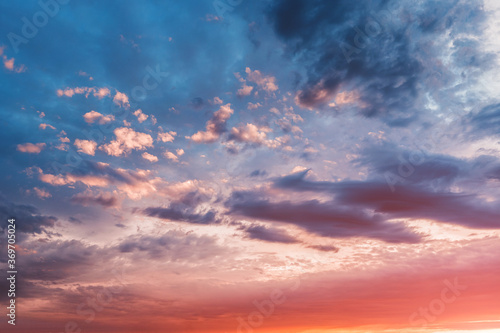 Colorful and peaceful sunset with red-tinted clouds. Sky Background or texture © EdNurg