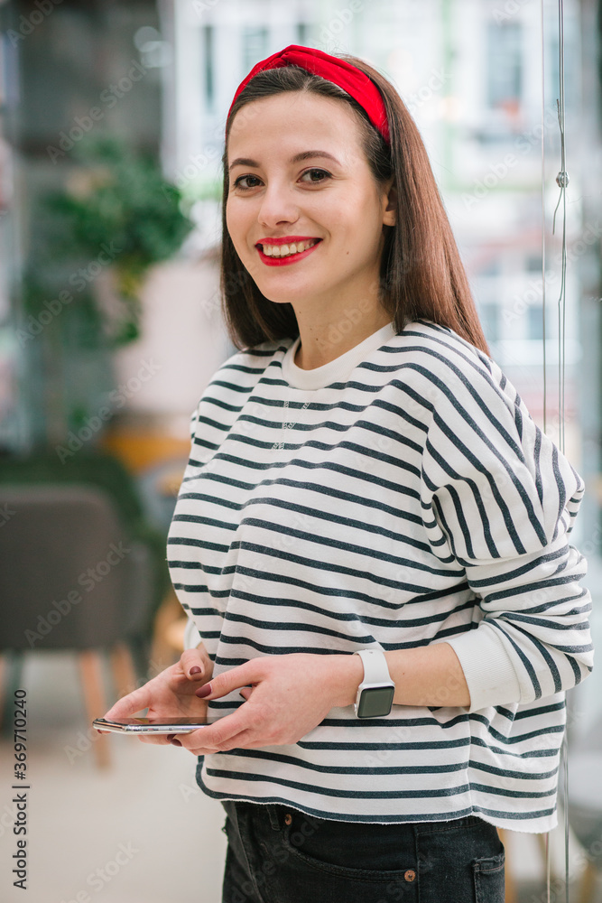 Cheerful lady looking satisfied with good Internet connection