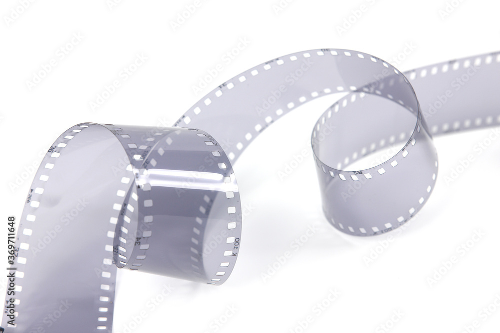 35mm film strip in white background, copy space cinema word with place for text,  film strip for festival, brochure, poster, banner or flyer. Film entertainment concept.