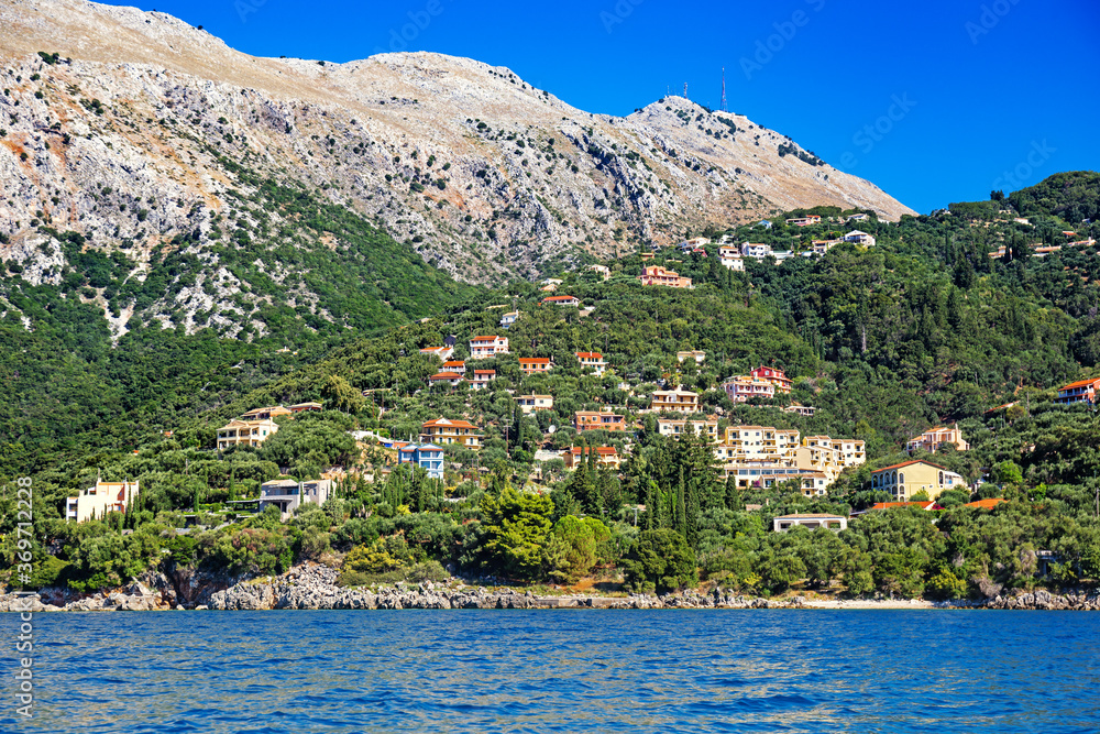 The picturesque mountains of Corfu island from the sea with Mount Pantokrator and Nisaki village in its foothills, Corfu, Greece