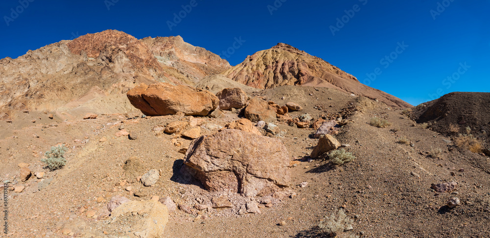 Boulders Washed Down the Aluvial Fan On the Multi-Colored Mountains of Artist's Palette, Death Valley National Park, California, USA Boulders Washed Down the Aluvial Fan On the Multi-Colored Mountains of Artist's Palette, Death Valley National Park, California, USA