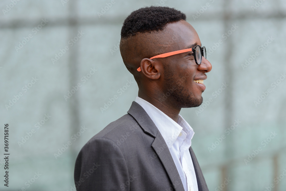 Young African businessman in the city outdoors Young African businessman in the city outdoors