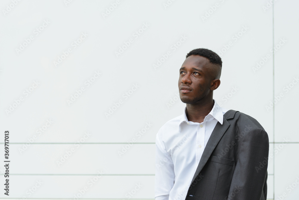Young African businessman in the city outdoors Young African businessman in the city outdoors