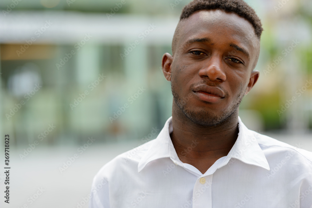 Young African businessman in the city outdoors Young African businessman in the city outdoors