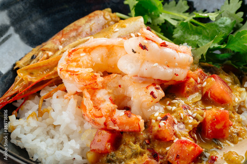 Asian dish curry with langoustines and hikari rice