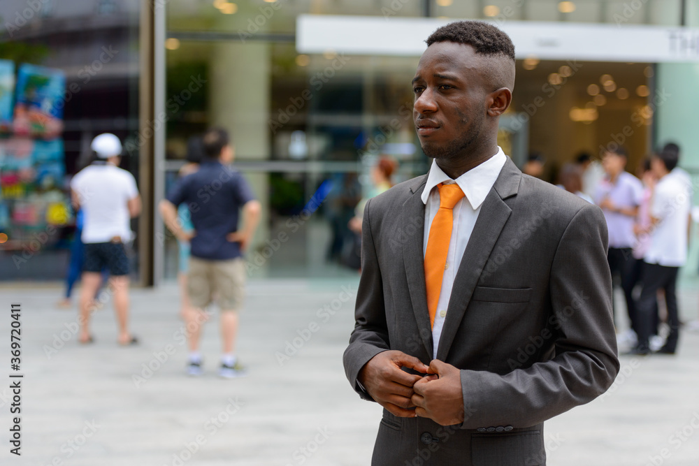 Young African businessman in the city outdoors Young African businessman in the city outdoors
