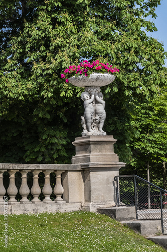 Ancient statues and flowers in Luxembourg Garden (Jardin du Luxembourg, 1612). Jardin du Luxembourg - second largest Public Park in Paris. France.